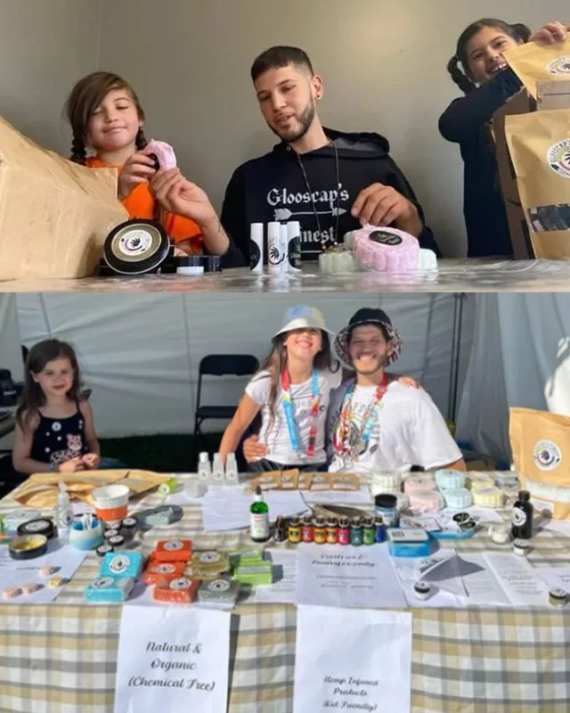 Clinton and family behind the Glooscap's Finest table at a market